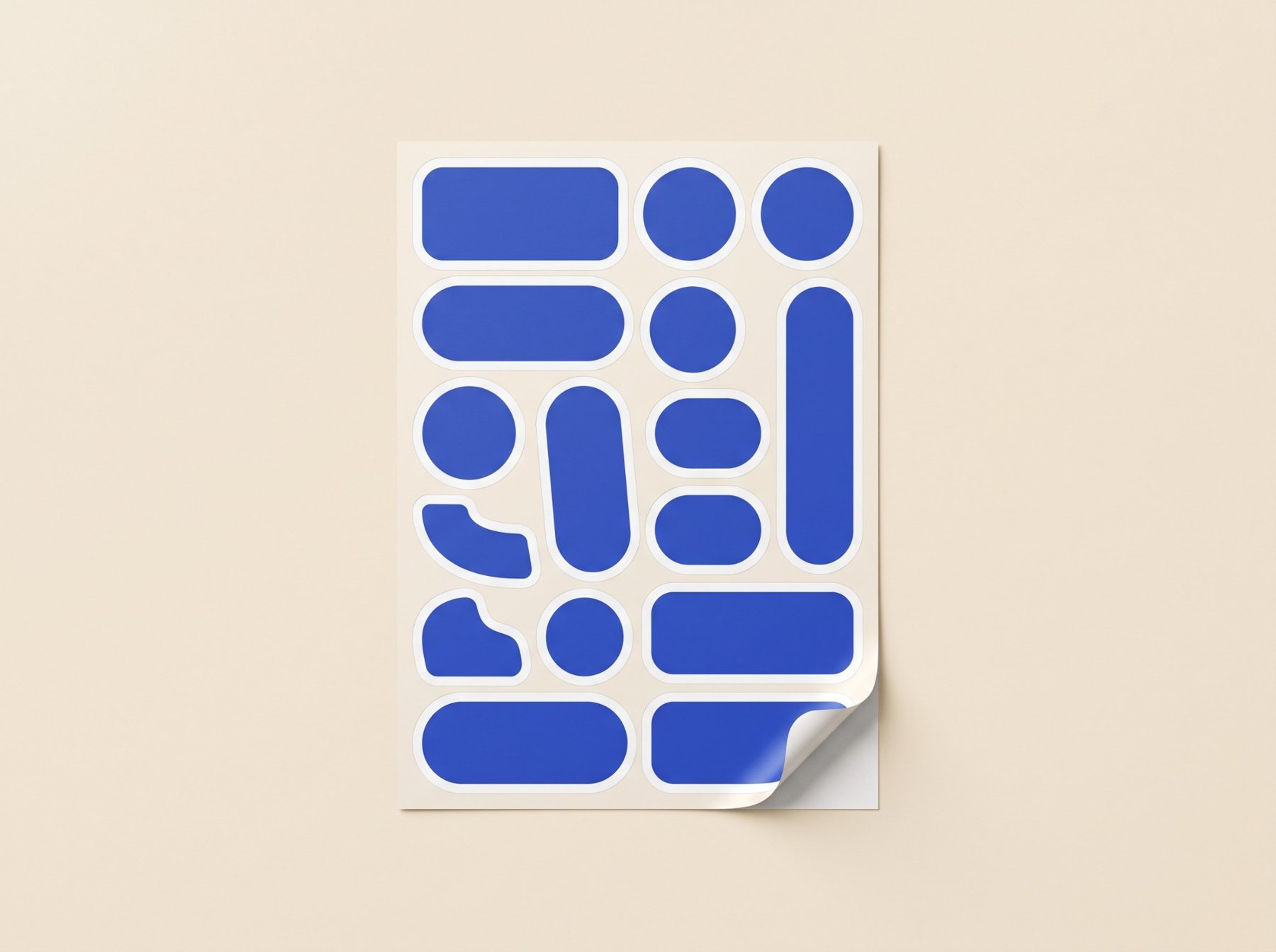 A sheet of blank blue die-cut stickers with one corner peeling up